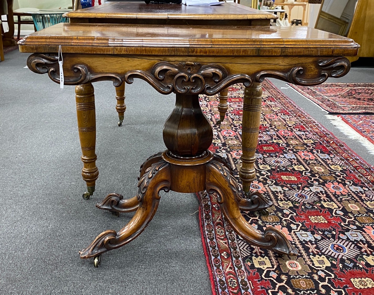An early Victorian rectangular rosewood folding card table width 92cm, depth 45cm, height 73cm